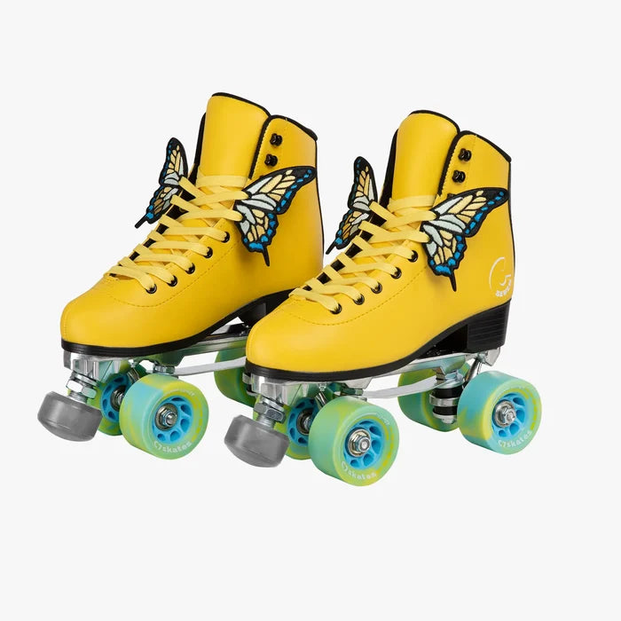 Yellow roller skates with butterfly designs on a white background