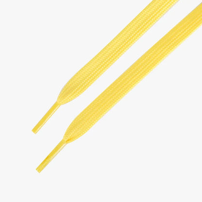 Yellow shoelaces on a white background