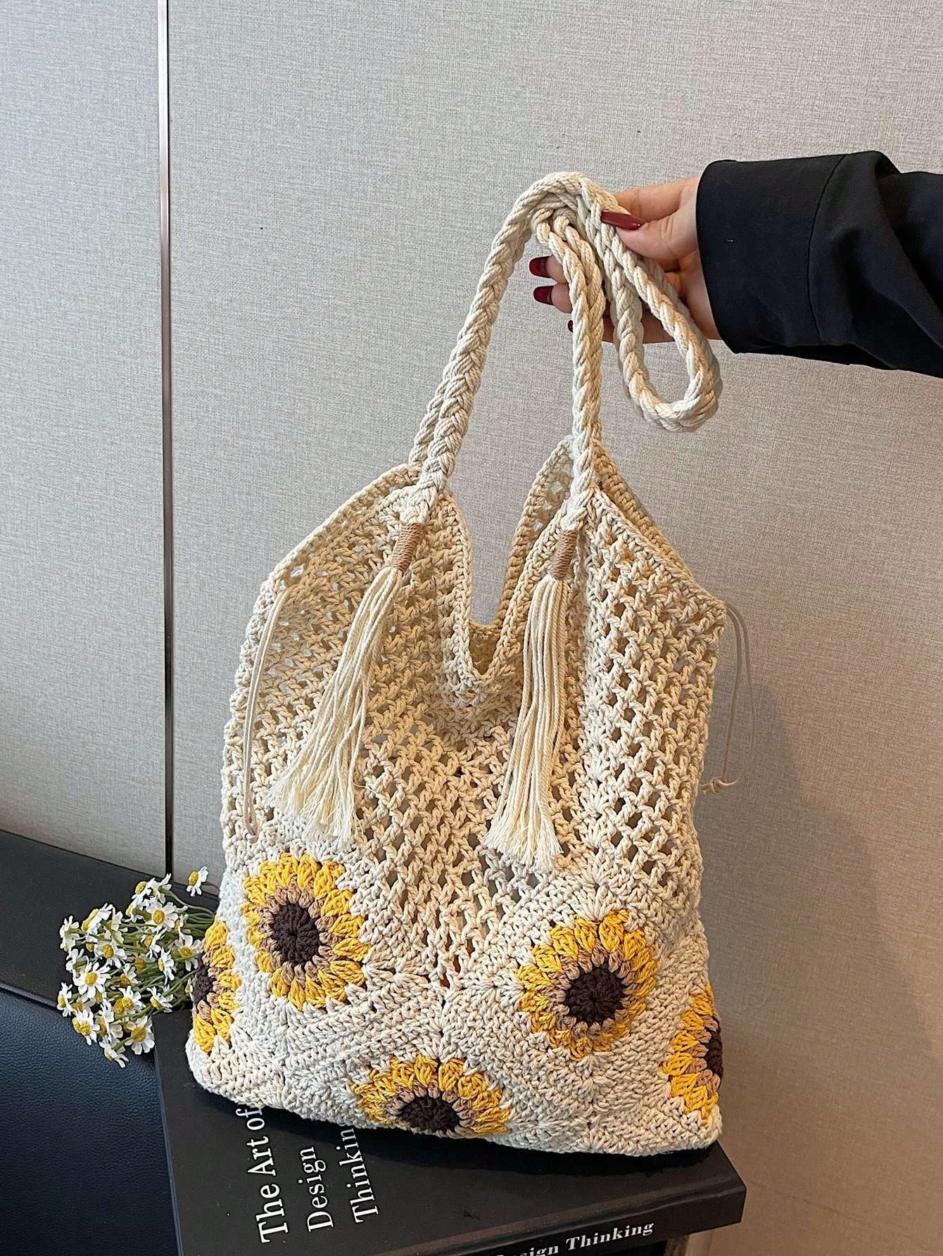 This Sunflower-Themed Hand-Crocheted Wool Tote Bag Is A Fashionable And Versatile Casual Women's Shoulder Bag. It Features Tassel Decoration, Lining, And A Drawstring Closure Design. Perfect For Beach