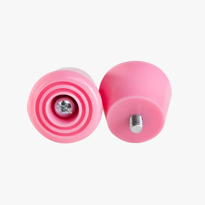 Two pink stoppers on a white background